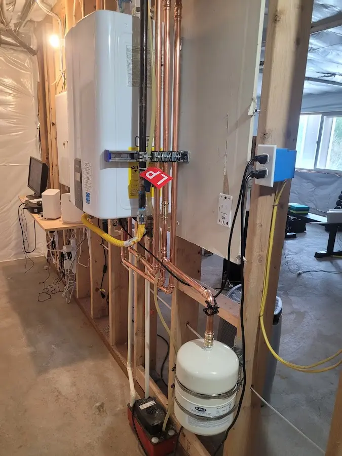 Licensed plumber repairing a kitchen sink in Stilwell
